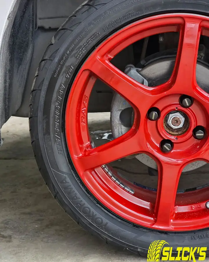 A red mag wheel fitted on a car